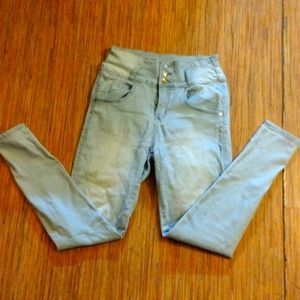 High-waist light blue skinny jeans with gold buttons size 9